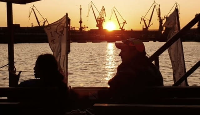 Sunset on the shipyard and old town cruise in Gdansk
